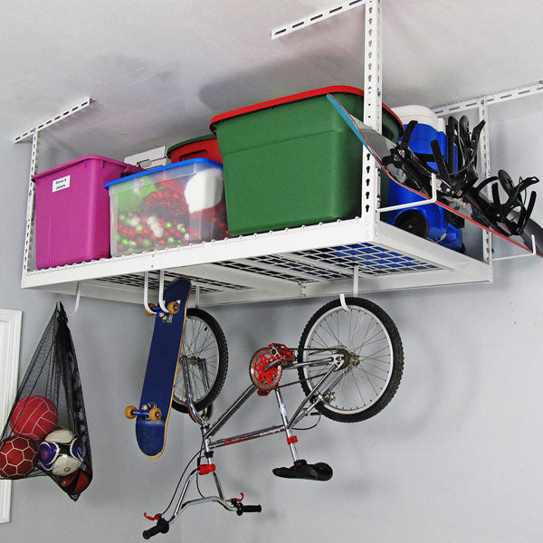 white overhead rack with bicycle, boards, and bins