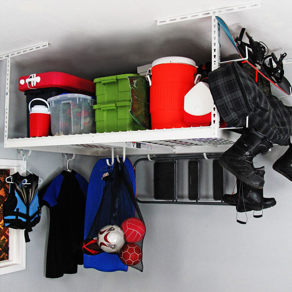 white overhead rack with boards, bins and sports equipment