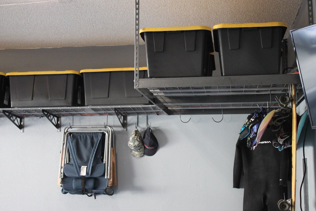 gray overhead rack with bins, chair and sporting equipment