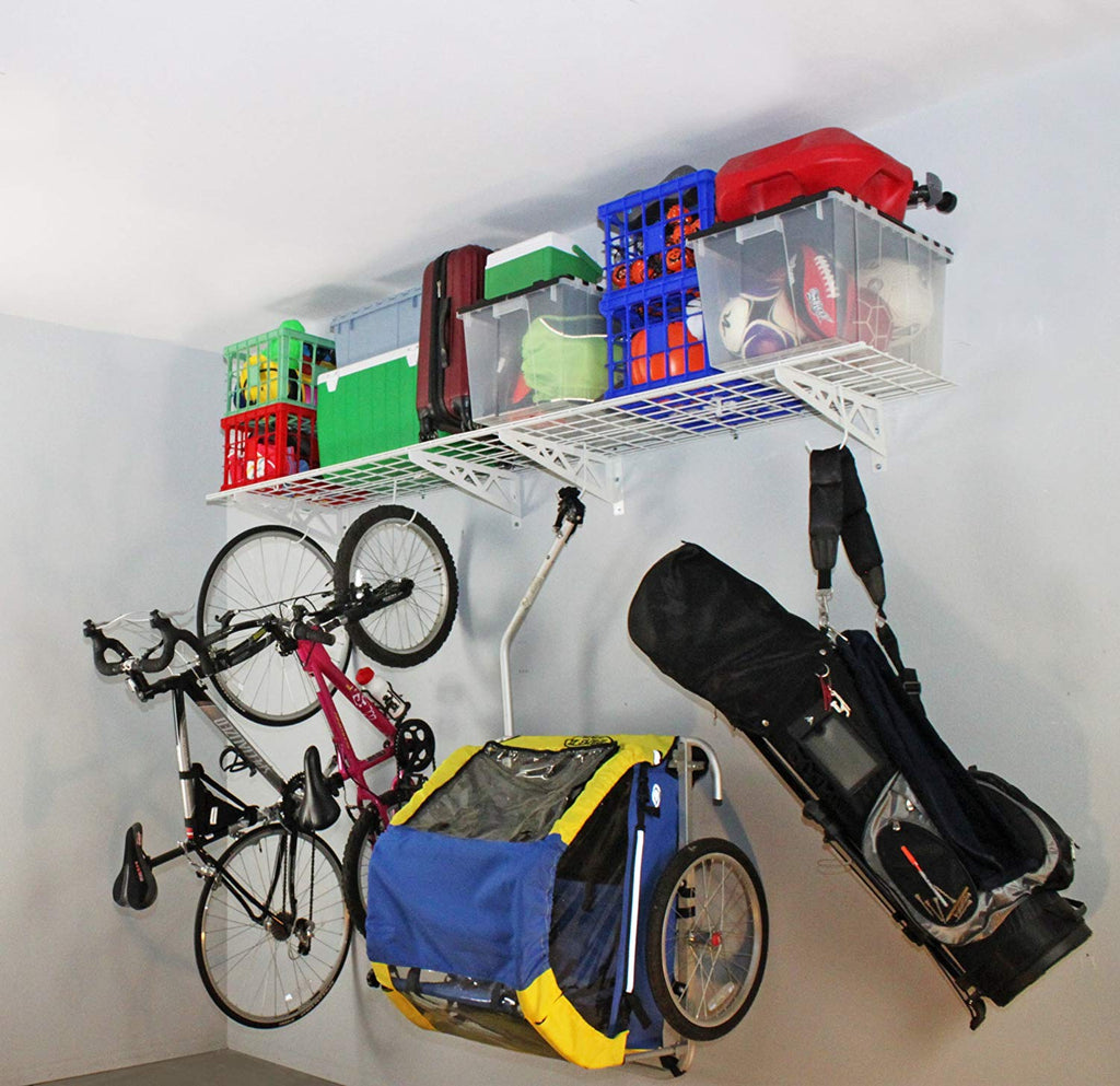 white wall shelves with bicycles and bins