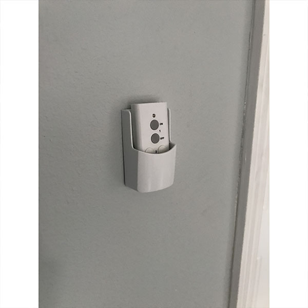 control holder mounted on wall