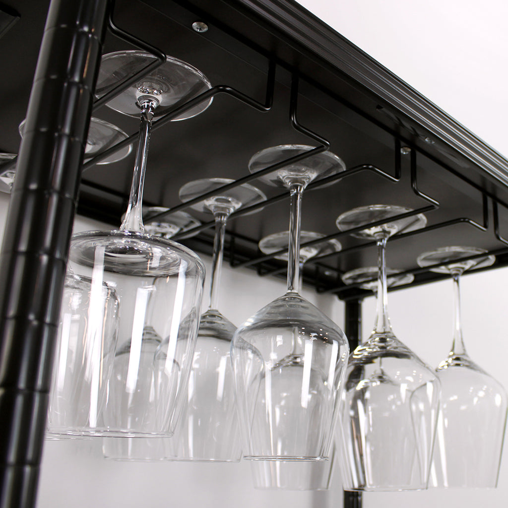 glasses hanging from stemware holder on top shelf